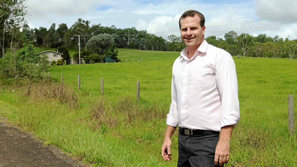 Telstra's Sunshine Coast and Gympie area manager, Kris Carver assures residents that the tower will be built behind the trees at the top of the hill behind him. Telstra's Sunshine Coast and Gympie area manager, Kris Carver assures residents that the tower will be built behind the trees at the top of the hill behind him.